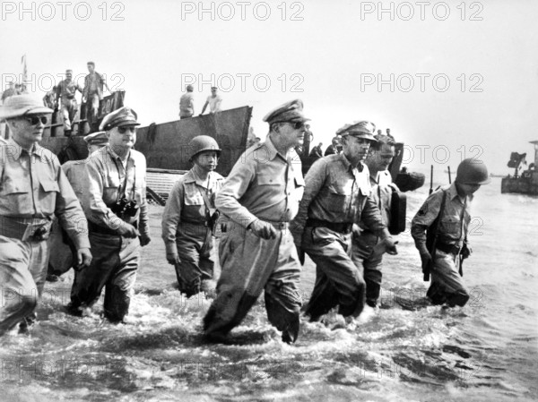 U.S. General Douglas MacArthur wading ashore during initial landings at Leyte Island, Philippine, U.S. Army Signal Corps, October 1944