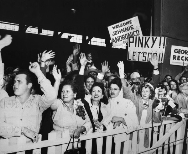 families of returning Prisoners of War waving and greeting USNS General Nelson M. Walker as it docks, Fort Mason, California, USA, U.S. Army Signal Corps, August 23, 1953