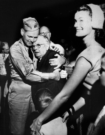 Repatriated Prisoner of War Captain, Frederick Smith is greeted by his father on his arrival on board the USNS Marine Phoenix, Fort Mason, California, USA, U.S. Army Signal Corps, September 14, 1953