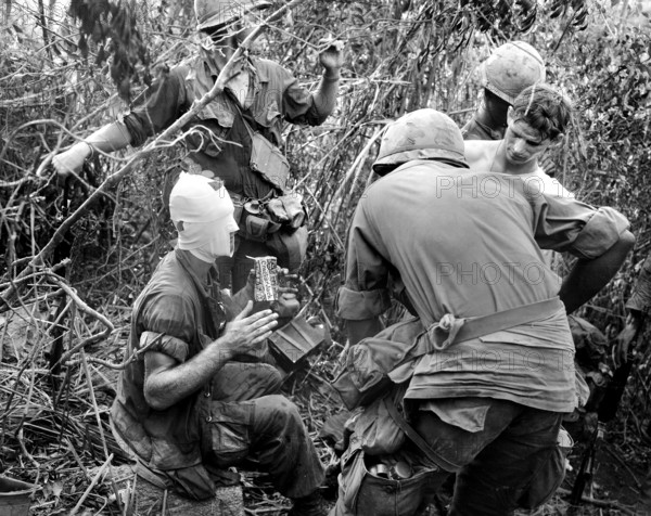 Members of Company "D" 1st Battalion, 501st Airborne Infantry relating battle and wounds received during action east of Tam Ky, Vietnam, U.S. Army Signal Corps, August 12, 1969
