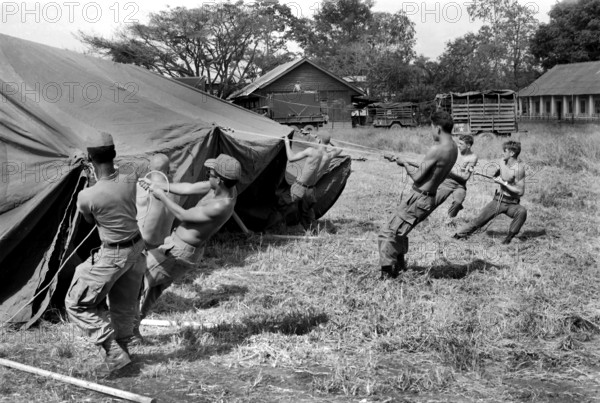 Personnel from U.S. Forward Mobile Staff putting up tent at their new location, Ban Me Thout, Vietnam, U.S. Army Signal Corps, 1970