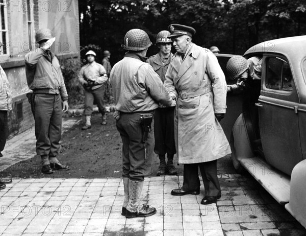 Major General Norman D. Cota greeting General George C. Marshall, U.S. Chief of Staff, on General Marshall's arrival at 28th Division headquarters, Elsenborn, Belgium, U.S. Army Signal Corps, October 22, 1944