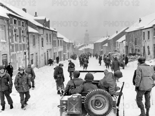 U.S. infantryman of 87th Division entering town after Germans fled, St. Hubert, Belgium, U.S. Army Signal Corps, 1945