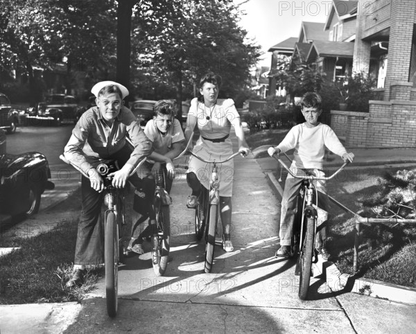 Boys and a girl on bicycles, Detroit, Michigan, USA, Arthur S. Siegel, U.S. Office of War Information, July 1942