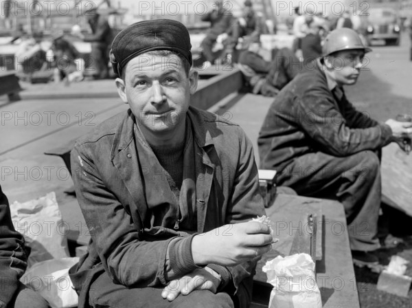 Factory worker on lunch break, Bethlehem-Fairfield shipyards, Baltimore, Maryland, USA, Arthur S. Siegel, U.S. Office of War Information, May 1943