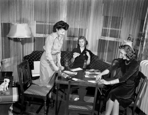 Three adult women playing cards and drinking Coca Cola, Detroit, Michigan, USA, Arthur S. Siegel, U.S. Office of War Information