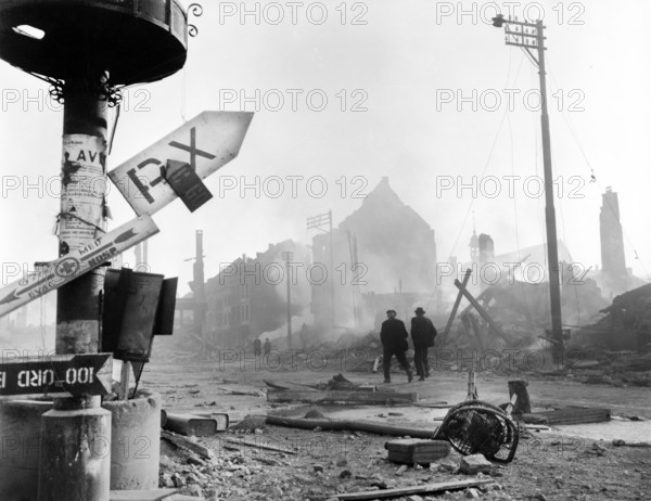 Signs left behind by U.S. troops occupying Malmedy, Belgian before it was retaken by Germans in counteroffensive, U.S. Army Signal Corps, December 28, 1944