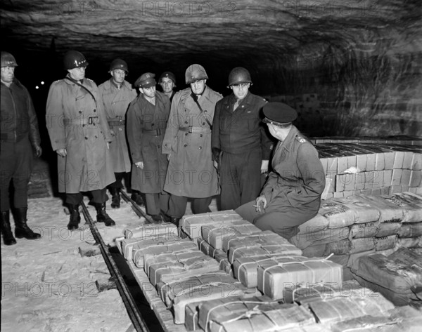 General Dwight D. Eisenhower, Supreme Allied commander, accompanied by General Omar N. Bradley, CG of the 12th Army Group; MG Manton Eddy, CG, XII Corps, and Colonel Bernard Burnstern, touring German salt mines in which stolen treasure was hidden, Merkers, Germany, U.S. Army Signal Corps, April 12, 1945