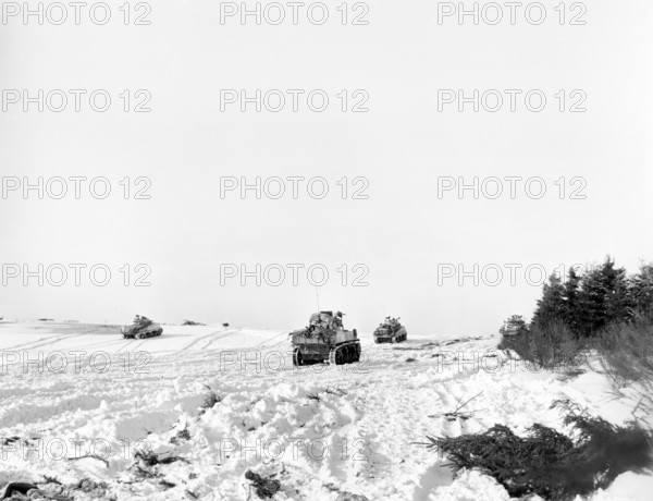 Tanks of U.S. 42nd Armored Battalion, moving into attack, Mabompre, Belgium, U.S. Army Signal Corps, January 16, 1945