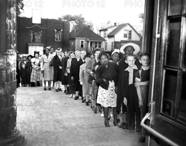 Group of people waiting in line at sugar rationing board, Detroit, Michigan, USA, Arthur S. Siegel, U.S. Office of War Information, April 1942