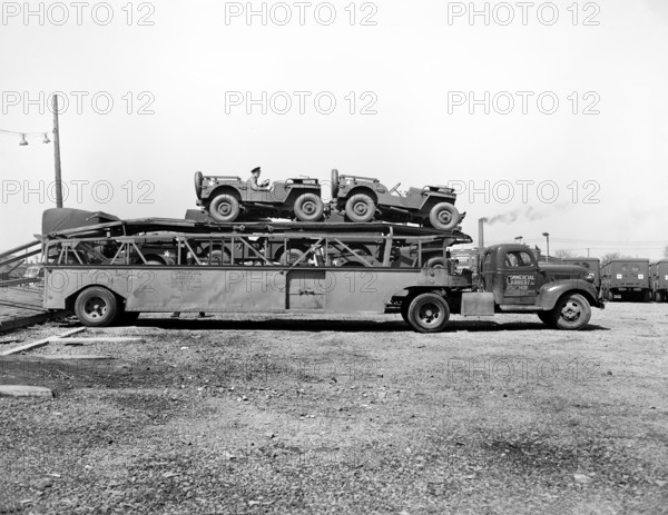 Haulaway loaded with U.S. Army vehicles, Detroit, Michigan, USA, Arthur S. Siegel, U.S. Office of War Information, April 1943