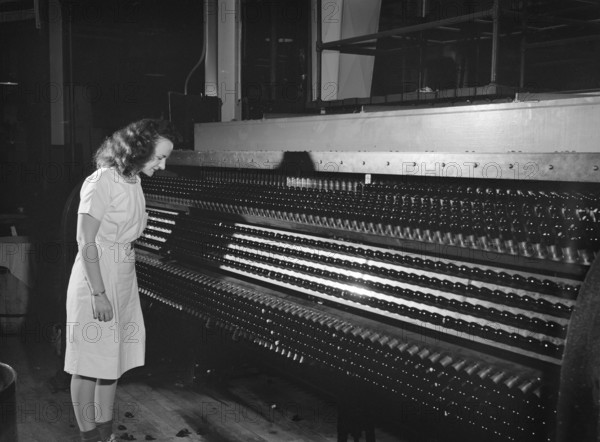 Manufacturing chemist monitoring production of gelatin capsules in special size, Parke, Davis and Company, Detroit, Michigan, USA, Arthur S. Siegel, U.S. Office of War Information, May 1943