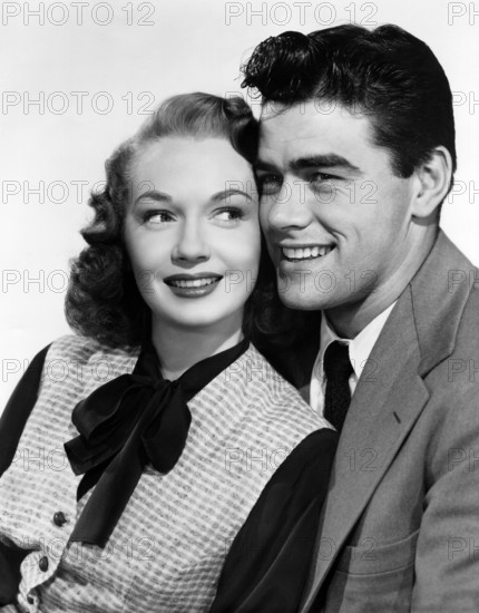 Gloria Henry, Jeff Richards, publicity portrait for the film, "Kill the Umpire", Columbia Pictures, 1950