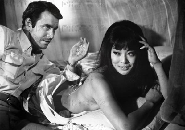 Lang Jeffries, Francesca Tu, on-set of the West German film, "Lotus Flowers for Miss Quon", German title: "Lotosblüten für Miss Quon", Gloria Film, 1967