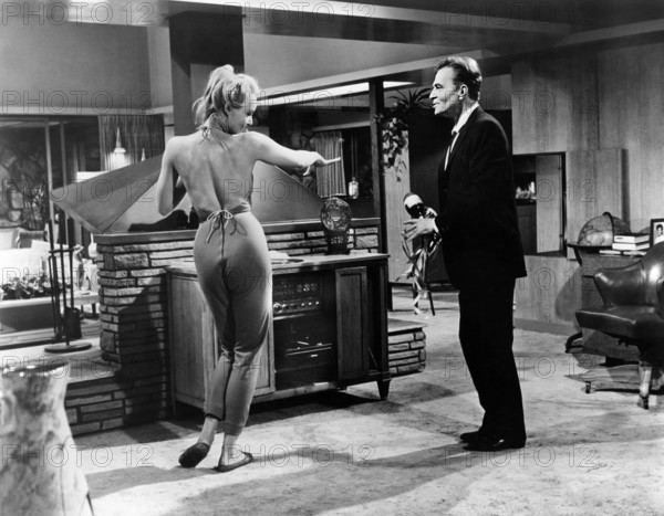 Julie Newmar, James Mason, on-set of the film, "The Marriage-Go-Round", 20th Century-Fox, 1961