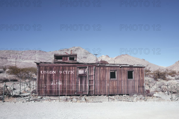 Abandoned Union Pacific train car in desert ghost town, Rhyolite, Nevada, USA