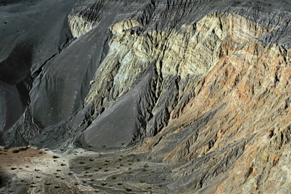 Large amounts of volcanic cinder deposits in basin and gullies on south facing wall of Ubehebe Crater, Death Valley National Park, California, USA