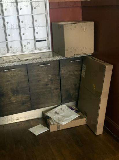 Packages delivered to apartment building lobby, Brooklyn, New York, USA