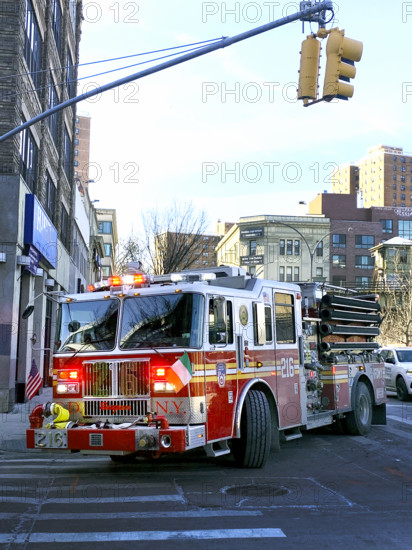 New York City Fire Department truck turning on street corner, Brooklyn, New York, USA