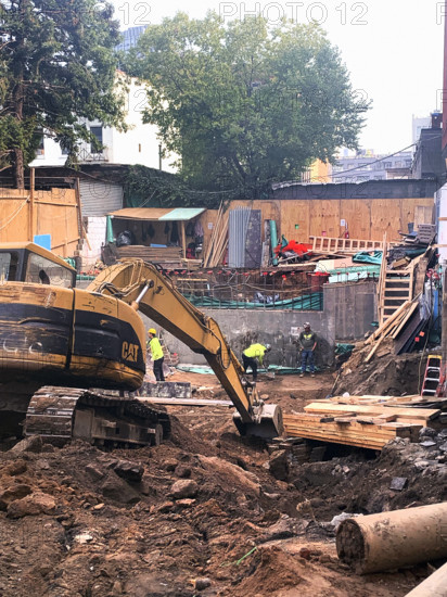 Construction site digging foundation, Brooklyn, New York, USA
