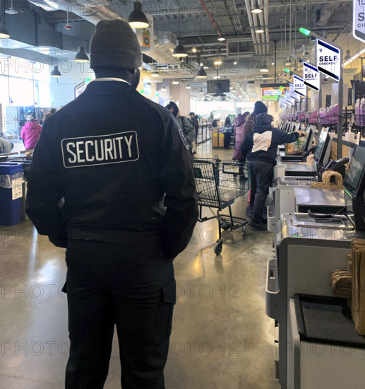 Security guard at self-checkout, Whole Foods Market, Williamsburg, Brooklyn, New York, USA