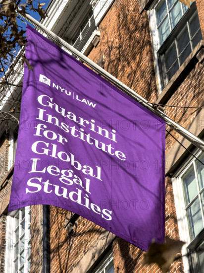 Guarini Institute for Global Legal Studies, New York University School of Law, building exterior with hanging banner, New York City, New York, USA