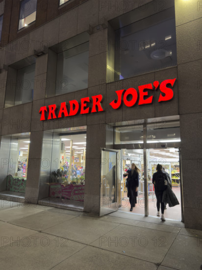 Trader Joe's grocery store, building exterior and entrance at night, New York City, New York, USA