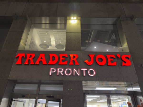 Trader Joe's Pronto, building exterior with company sign at night, New York City, New York, USA,
