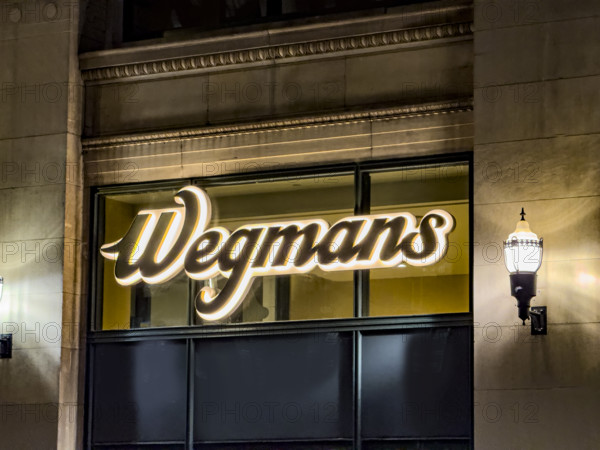 Wegman's, store logo on building exterior at night, low angle view of company sign, New York City, New York, USA