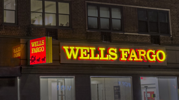 Wells Fargo retail bank office, building exterior at night, New York City, New York, USA