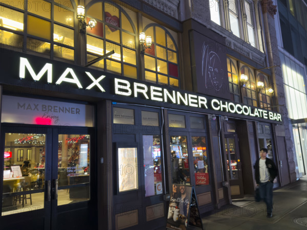 Max Brenner Chocolate Bar, building exterior at night, New York City, New York, USA