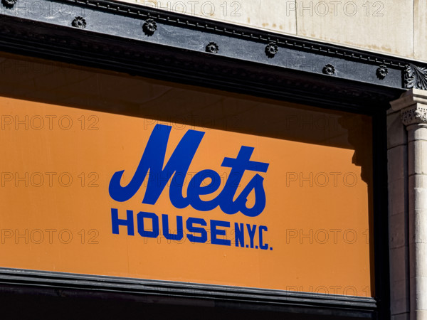 Mets House NYC, pop-up store and activities space, building exterior detail of orange and blue store sign, New York City, New York, USA
