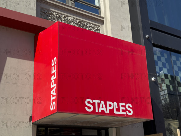 Staples office supplies store, building exterior and store sign above entrance, New York City, New York, USA