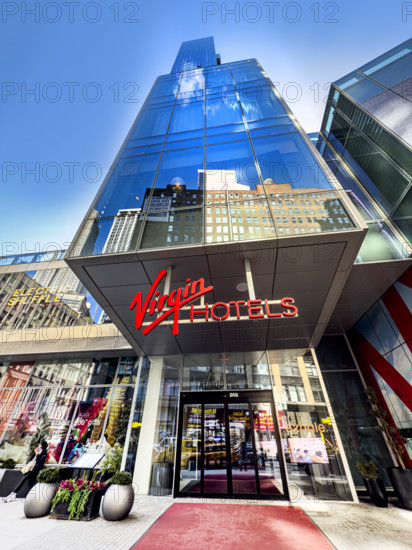 Virgin Hotel, low angle view of building exterior and entrance, New York City, New York, USA