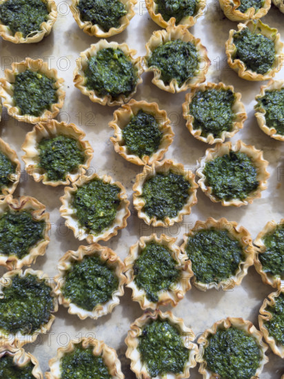 High angle view of mini spanakopita pies
