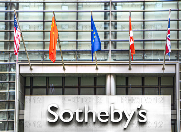 Sotheby's, building exterior detail of flags above company sign, 1334 York Avenue, New York City, New York, USA