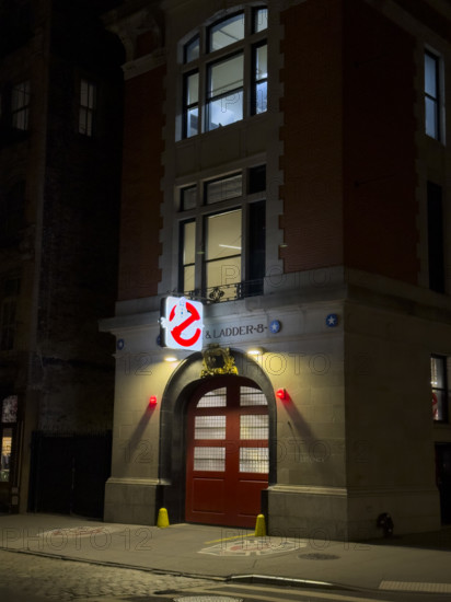 Beaux-Arts style firehouse from 1903 illuminated at night, made famous as the headquarters of the 1984 film, "Ghostbusters", New York City, New York, USA