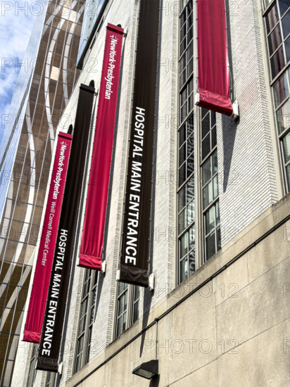 New York-Presbyterian / Weill Cornell Medical Center, building exterior with information banners hanging above main entrance, low angle view, 525 East 68th Street, New York City, New York, USA