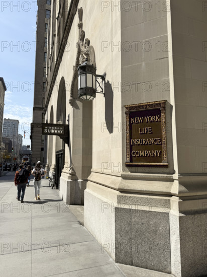 New York Life Insurance Company sign on New York Life building exterior and sidewalk scene, New York City, New York, USA