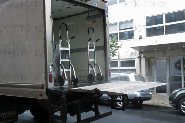 Moving truck parked on street
