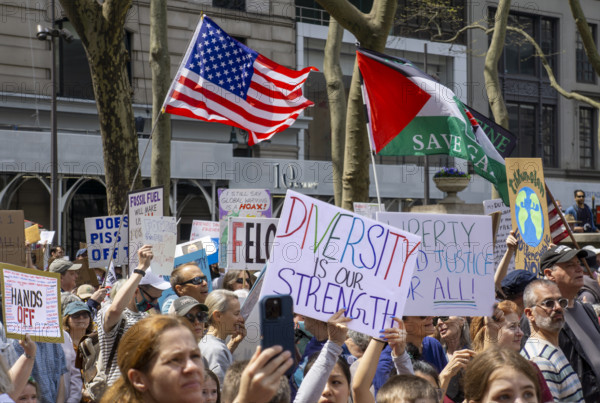 Demonstrators participating in "Our City, Our Fight: Protect Migrants, Protect the Planet" protest, New York City, New York, April 19, 2025