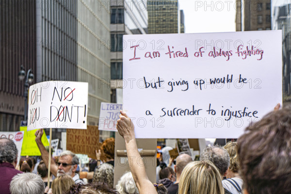 Demonstrators participating in "Our City, Our Fight: Protect Migrants, Protect the Planet" protest, New York City, New York, April 19, 2025