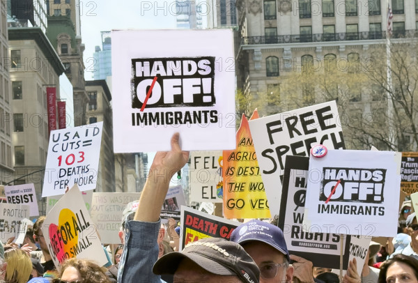 Demonstrators participating in "Our City, Our Fight: Protect Migrants, Protect the Planet" protest, New York City, New York, April 19, 2025