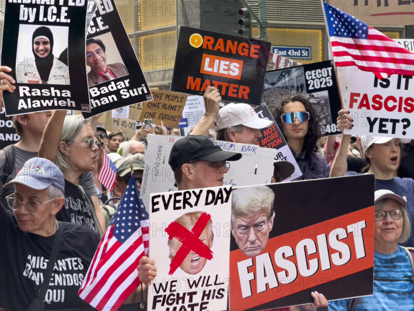 Demonstrators participating in "Our City, Our Fight: Protect Migrants, Protect the Planet" protest, New York City, New York, April 19, 2025