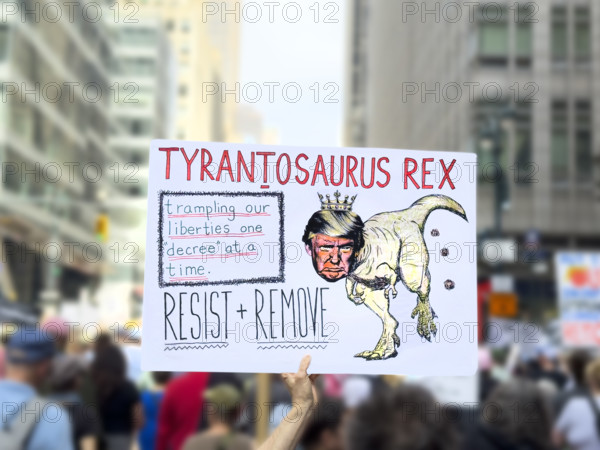 Demonstrators participating in "Our City, Our Fight: Protect Migrants, Protect the Planet" protest, New York City, New York, April 19, 2025