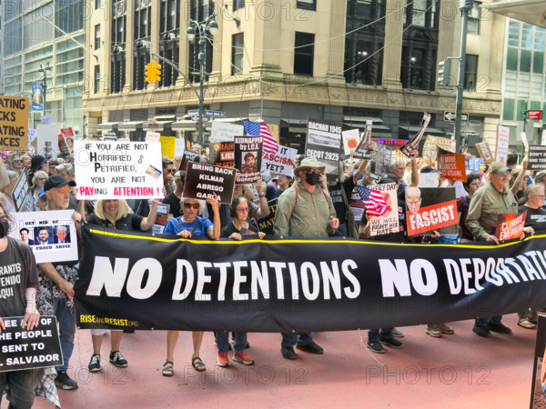 Demonstrators participating in "Our City, Our Fight: Protect Migrants, Protect the Planet" protest, New York City, New York, April 19, 2025
