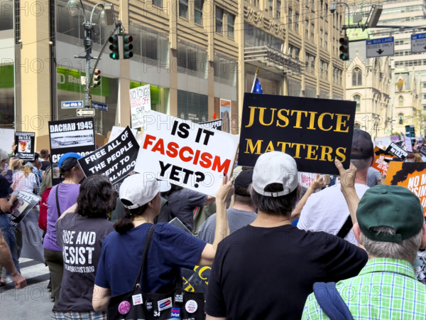 Demonstrators participating in "Our City, Our Fight: Protect Migrants, Protect the Planet" protest, New York City, New York, April 19, 2025