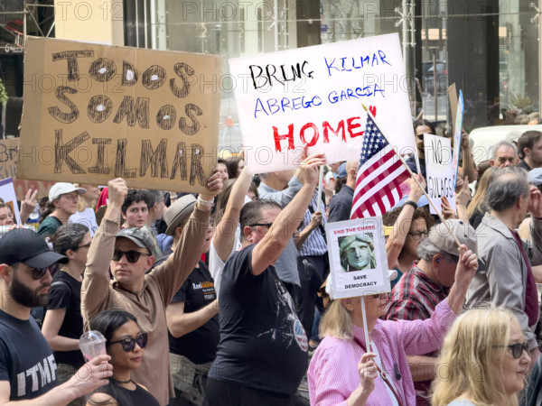 Demonstrators participating in "Our City, Our Fight: Protect Migrants, Protect the Planet" protest, New York City, New York, April 19, 2025