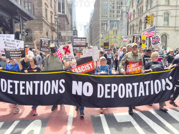 Demonstrators participating in "Our City, Our Fight: Protect Migrants, Protect the Planet" protest, New York City, New York, April 19, 2025