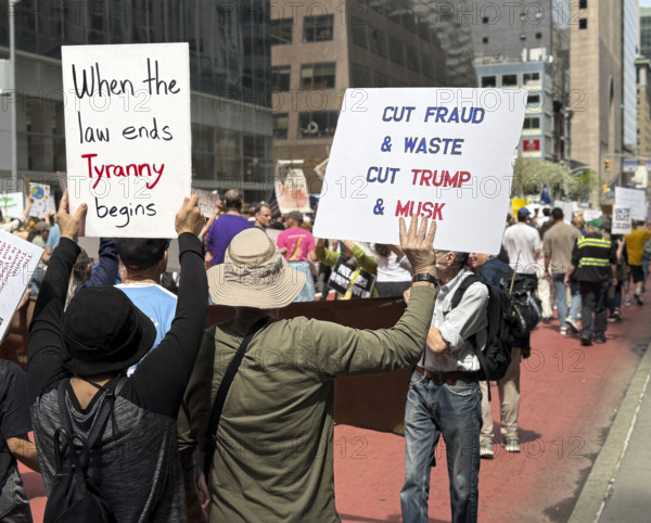 Demonstrators participating in "Our City, Our Fight: Protect Migrants, Protect the Planet" protest, New York City, New York, April 19, 2025